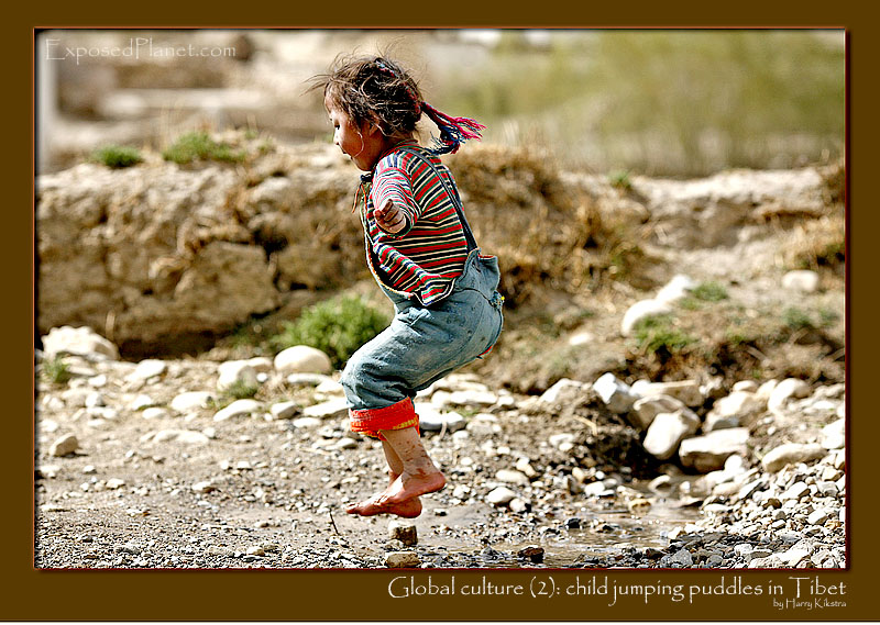 Global culture (2): little girl jumping puddles in Tibet
